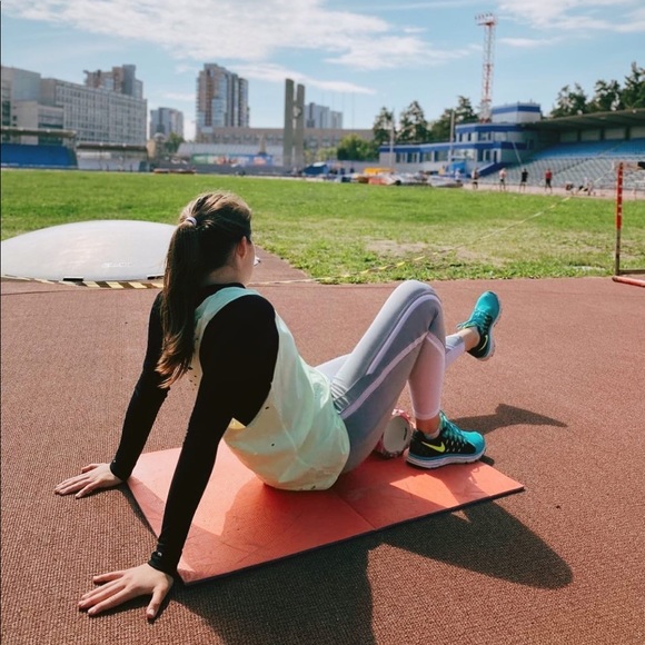 *NIKE* neon yellow running singlet. Used for competing track and filed events. - Picture 2 of 4